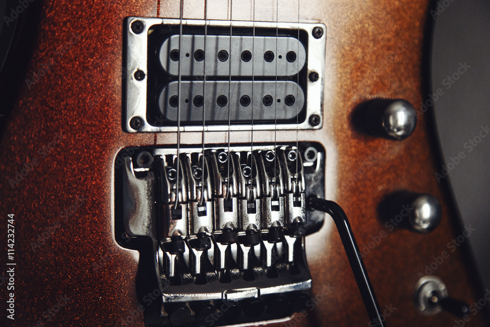 Electric guitar detail view, zoom in to floyd rose, very shallow depth of field image, cinematic effect applied Electric guitar detail view, zoom in to floyd rose, very shallow depth of field image, cinematic effect applied