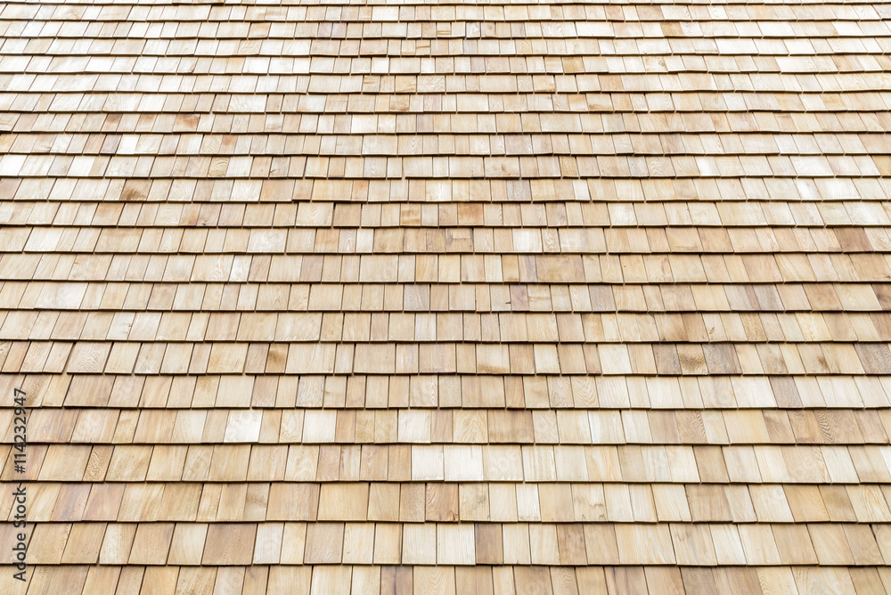 Several wood cedar shingles for siding or roofs. Several wood cedar shingles for siding or roofs.