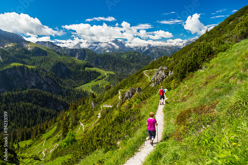 hiker on a mountain trail in the alps / Wanderer auf Wanderweg in den Alpen