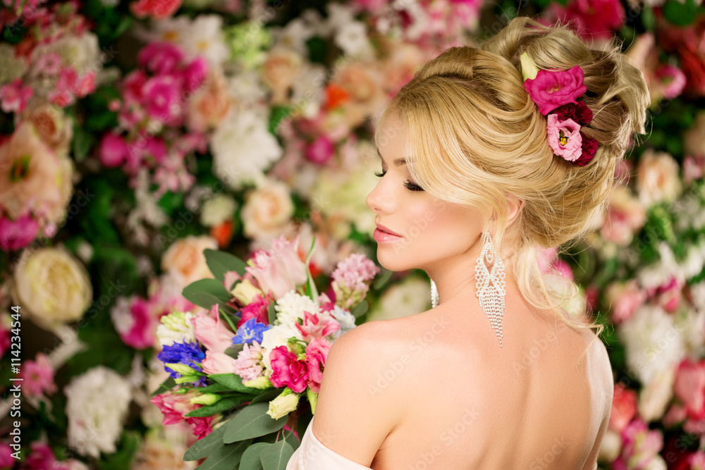 Wedding hairstyle a young girl. Bride. Woman with Flowers in her Wedding hairstyle a young girl. Bride. Woman with Flowers in her