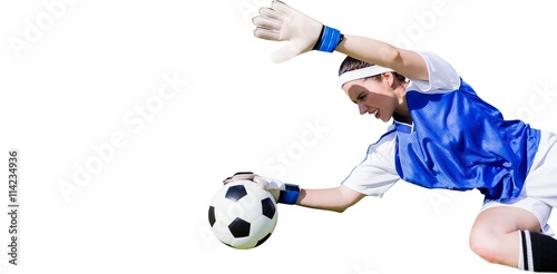 Woman goalkeeper stopping a goal 
