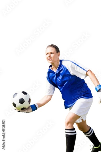 Woman goalkeeper throwing again the ball