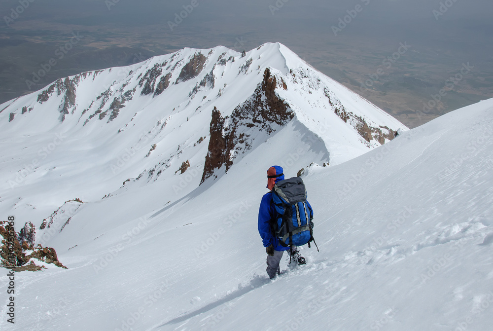 Male climber descends from the top of Erciyes volcano.