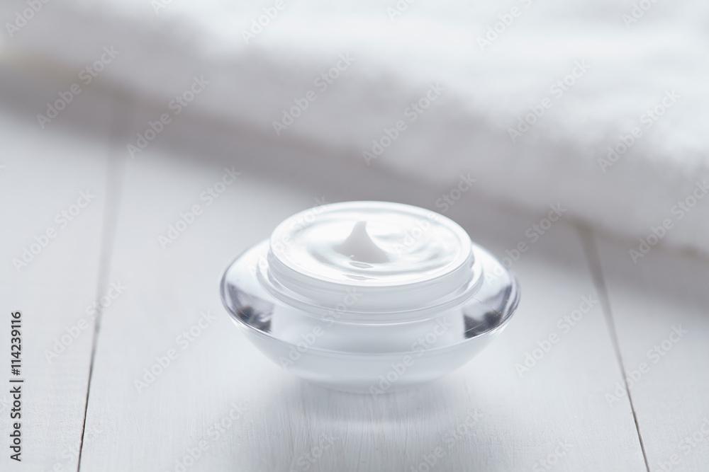 Cosmetic cream white organic beauty moisturizer cleansing acne product with towel on white background. Dermatology hygienic anti aging, wrinkles, blemish, pimples, blackheads clear treatment Cosmetic cream white organic beauty moisturizer cleansing acne product with towel on white background. Dermatology hygienic anti aging, wrinkles, blemish, pimples, blackheads clear treatment