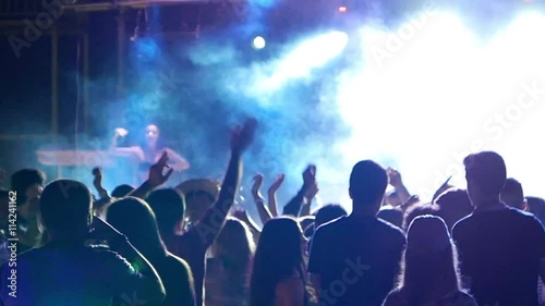 Celebration, holiday, feast. Night Beach Disco Go-go with illumination, concert near sea. Dancing people with fun gladness on the discotheque entertainment. Gaiety merriment joyfulness of teens