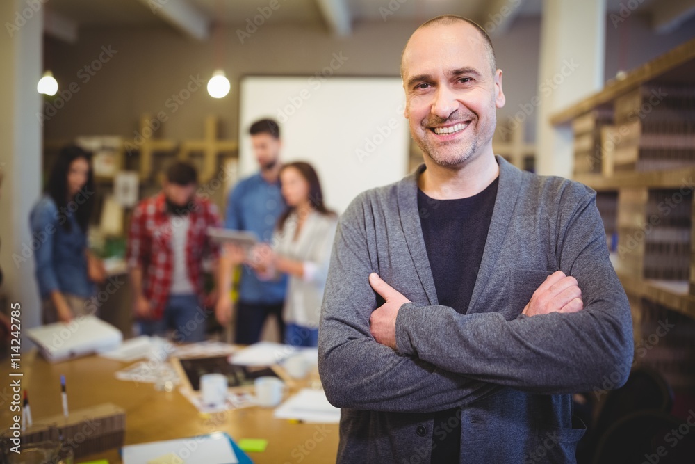 Fototapeta premium Confident businessman with arms crossed