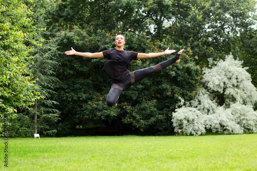 A jazz dancer performing a jump