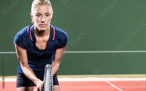 Composite image of tennis player playing tennis with a racket  © vectorfusionart