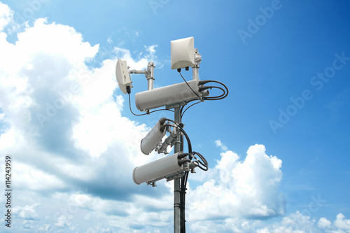 Photos Cellular network antenna with wifi hotspot repeater and blue sky