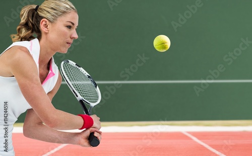 Composite image of athlete playing tennis with a racket © vectorfusionart