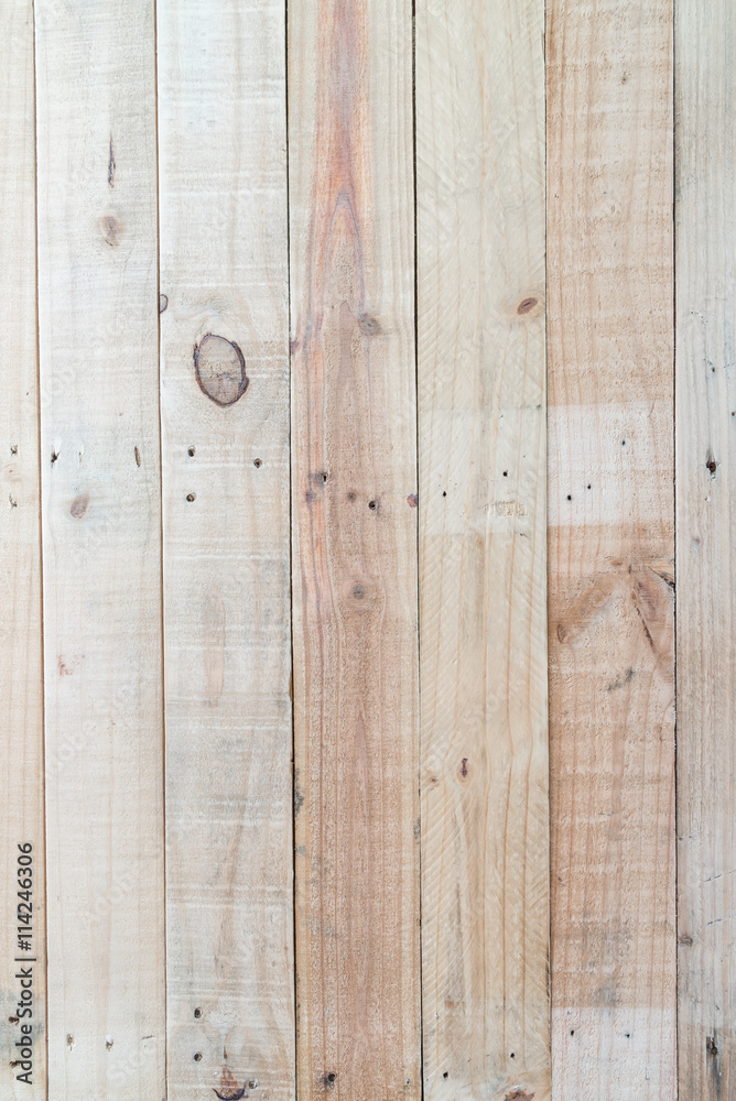 Fototapeta premium Grunge brown wood wall background with knots and nail holes