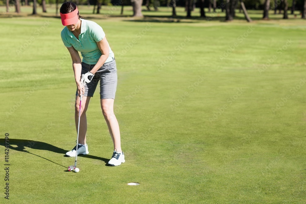 Full length of woman playing golf