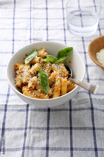 pasta with cheese and basil in bowl