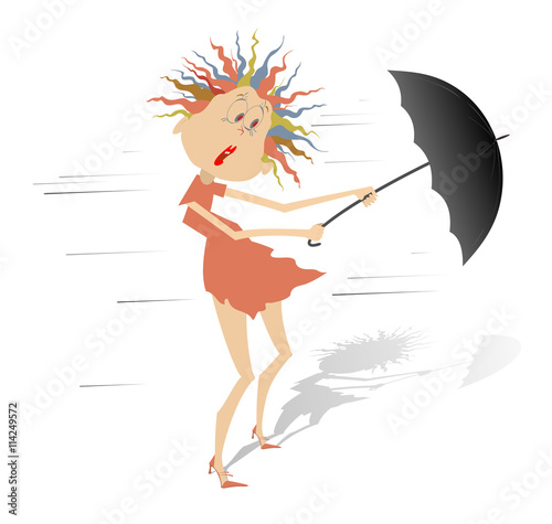 Windy day. Woman taken up with the wind tries to keep an umbrella 
