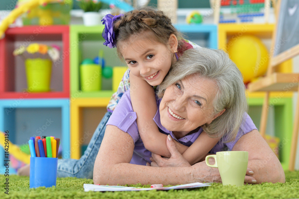 girl making homework with granny girl making homework with granny