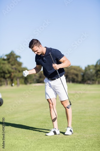 Golfer clenching fists
