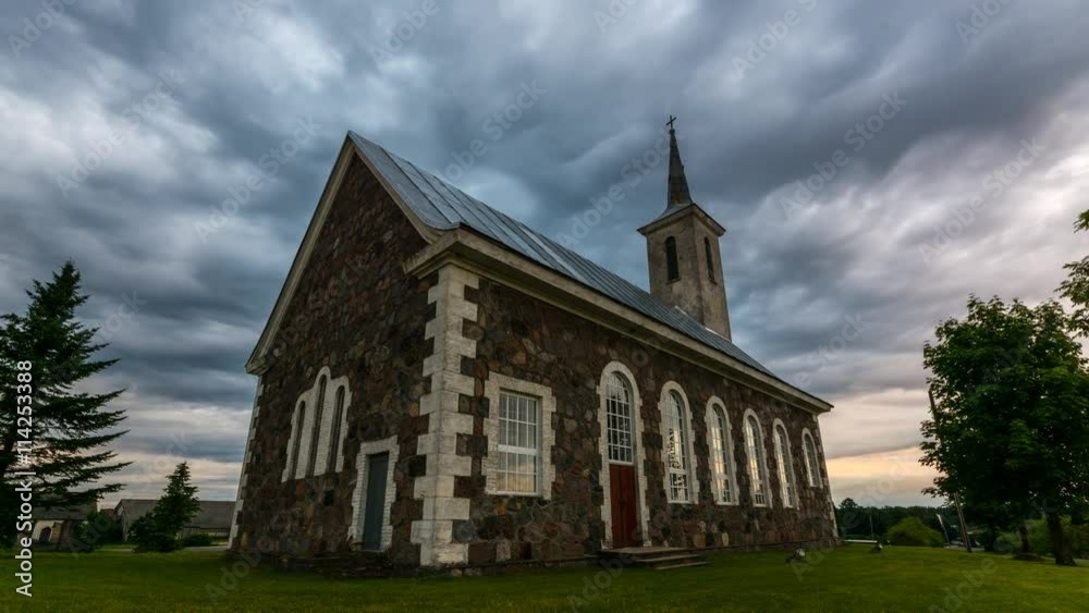 Old catholic church with massive clouds. Epic sunset. Timelapse. Old catholic church with massive clouds. Epic sunset. Timelapse.