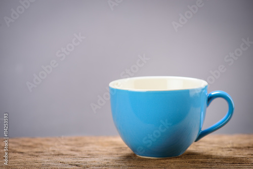 blue coffee cups on wood board