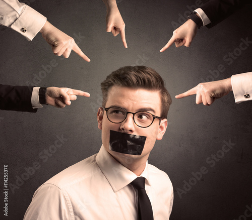 multiple hands pointing at business employee photo