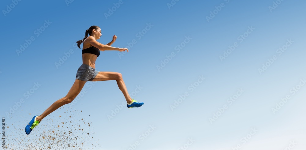 Composite image of profile view of sportswoman jumping 