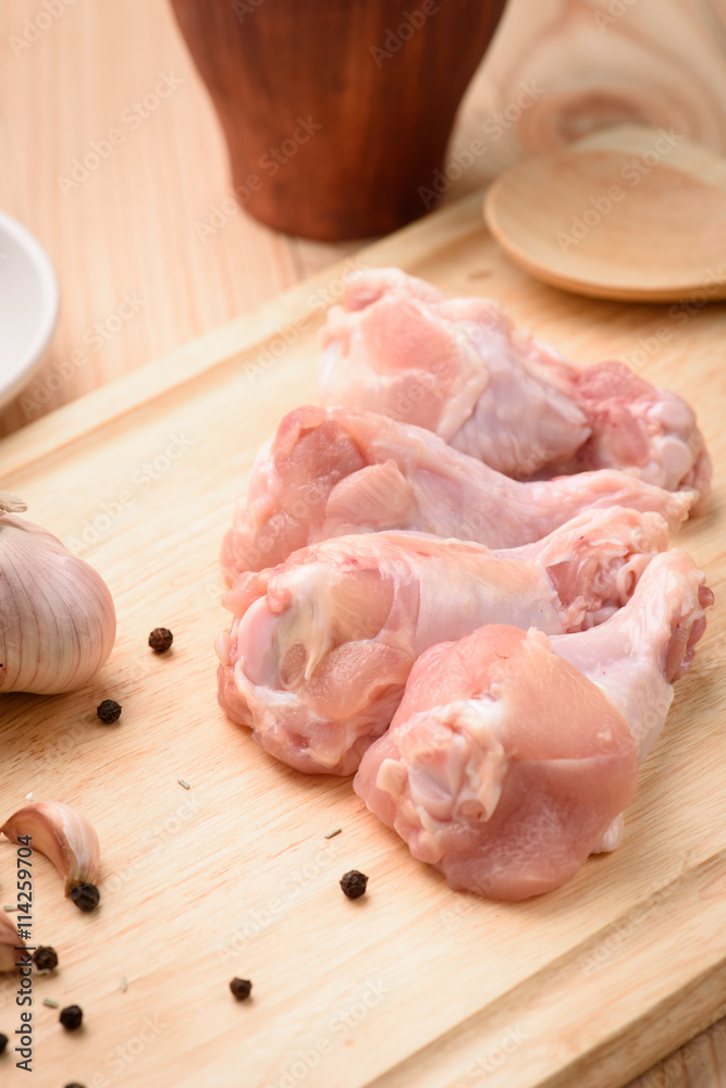 Chicken wings (wingstick) uncooked with garlic and black pepper Chicken wings (wingstick) uncooked with garlic and black pepper