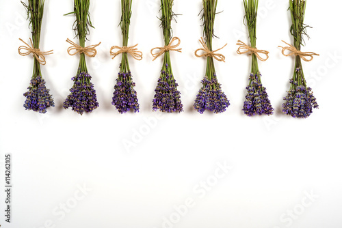 bouquets of lavender over an old rustic wooden background