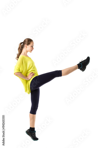 Woman does exercises on a white background.