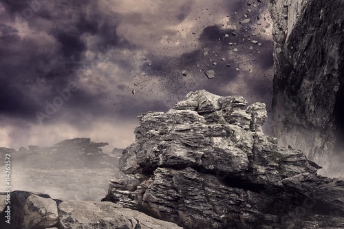 Rock crashing down from cliff