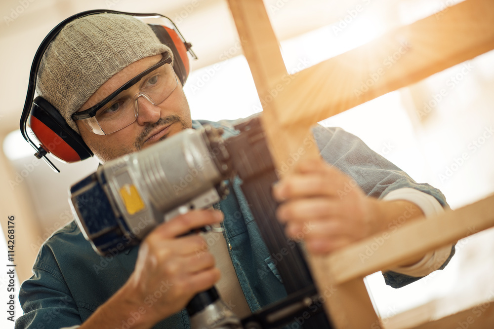 Close up of a young carpenter at work Close up of a young carpenter at work