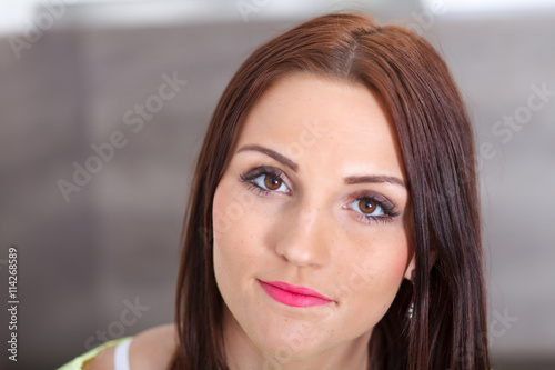 Portrait of a beautiful young smiling woman.