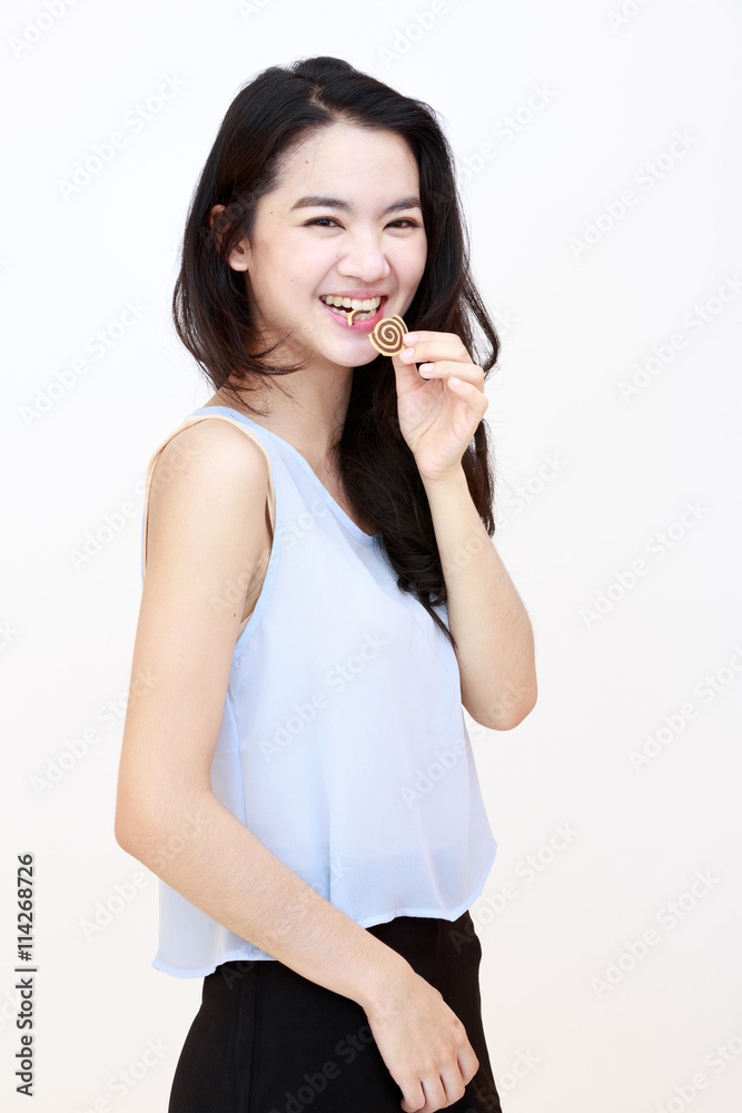 Young pretty lady with cookie isolated on white Young pretty lady with cookie isolated on white
