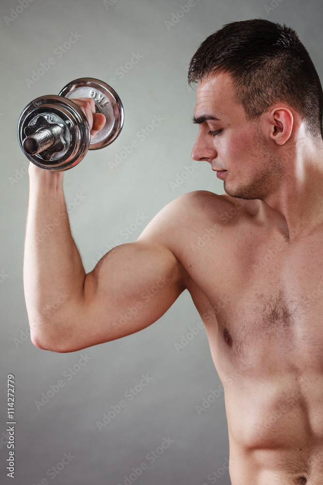 athletic man working with heavy dumbbells athletic man working with heavy dumbbells