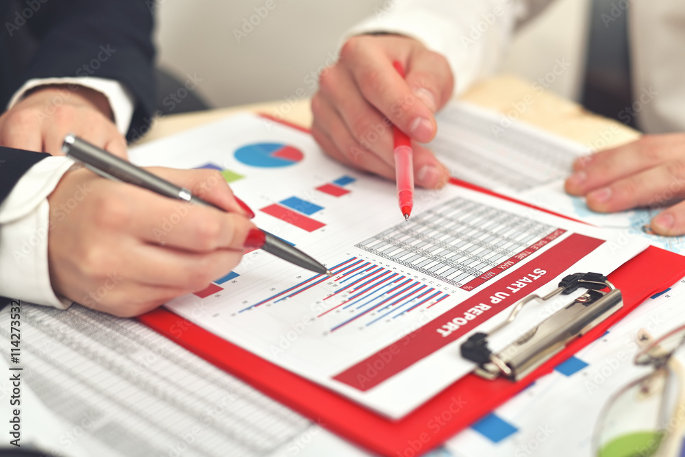 human hands analyzing the business diagrams human hands analyzing the business diagrams