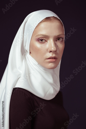 Young Religious Woman In A White Shawl