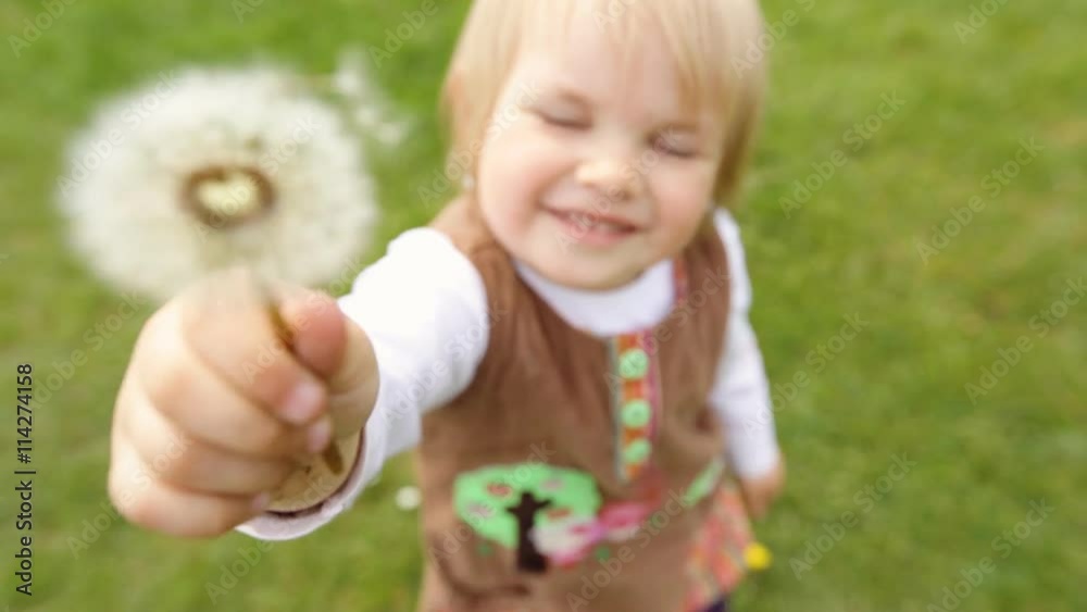 Adorable child showing pissabed in the garden. Adorable child showing pissabed in the garden.