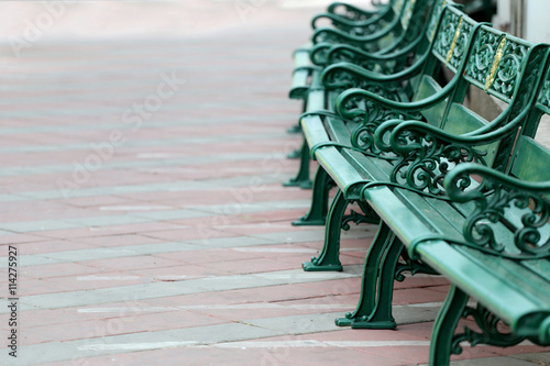 Photo Green benches in the public park equipment furniture of decorate