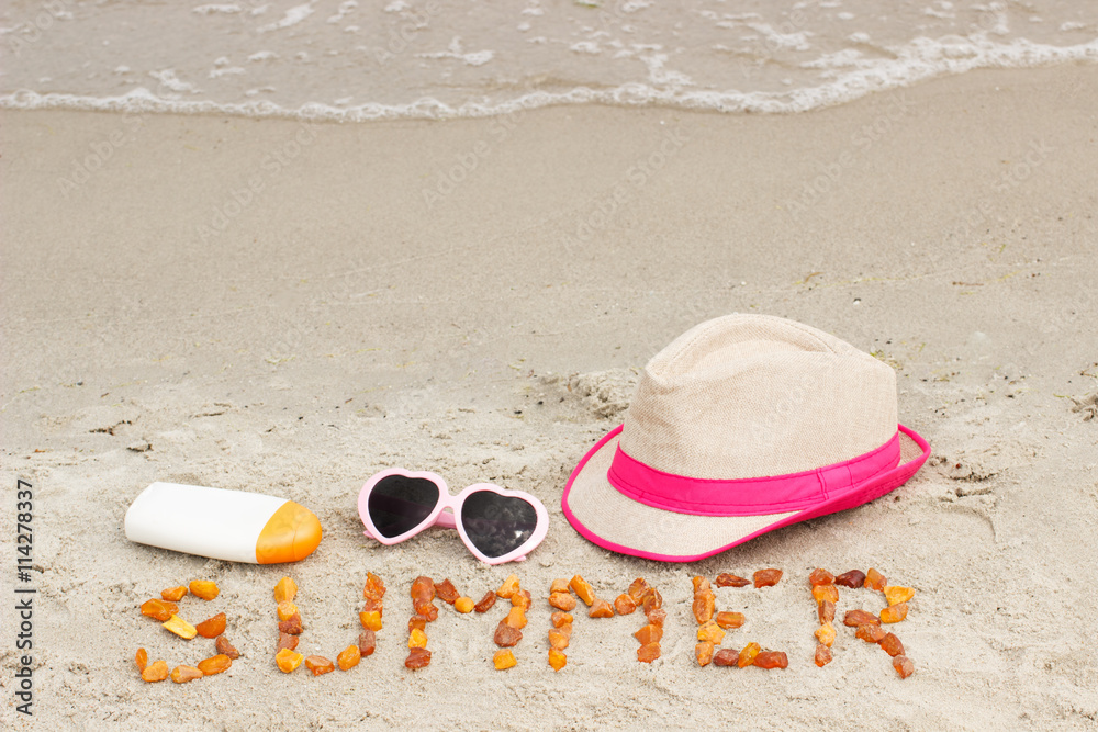 Inscription summer and accessories for vacation on sand at beach, sun protection, summer time Inscription summer and accessories for vacation on sand at beach, sun protection, summer time