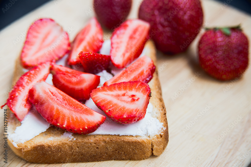 Toast with cheese and strawberries
