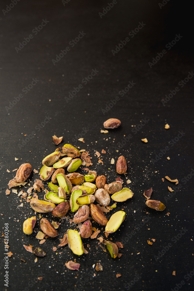 pistachios on black slate table pistachios on black slate table