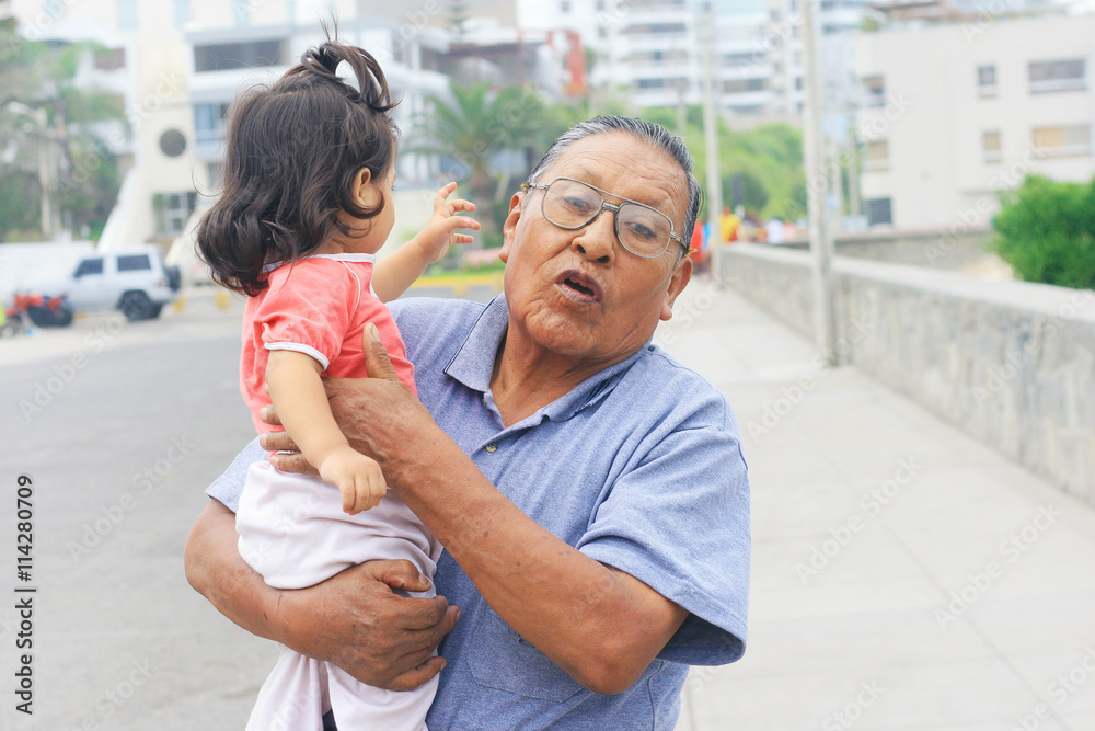 Latin grandfather with granddaughter Latin grandfather with granddaughter