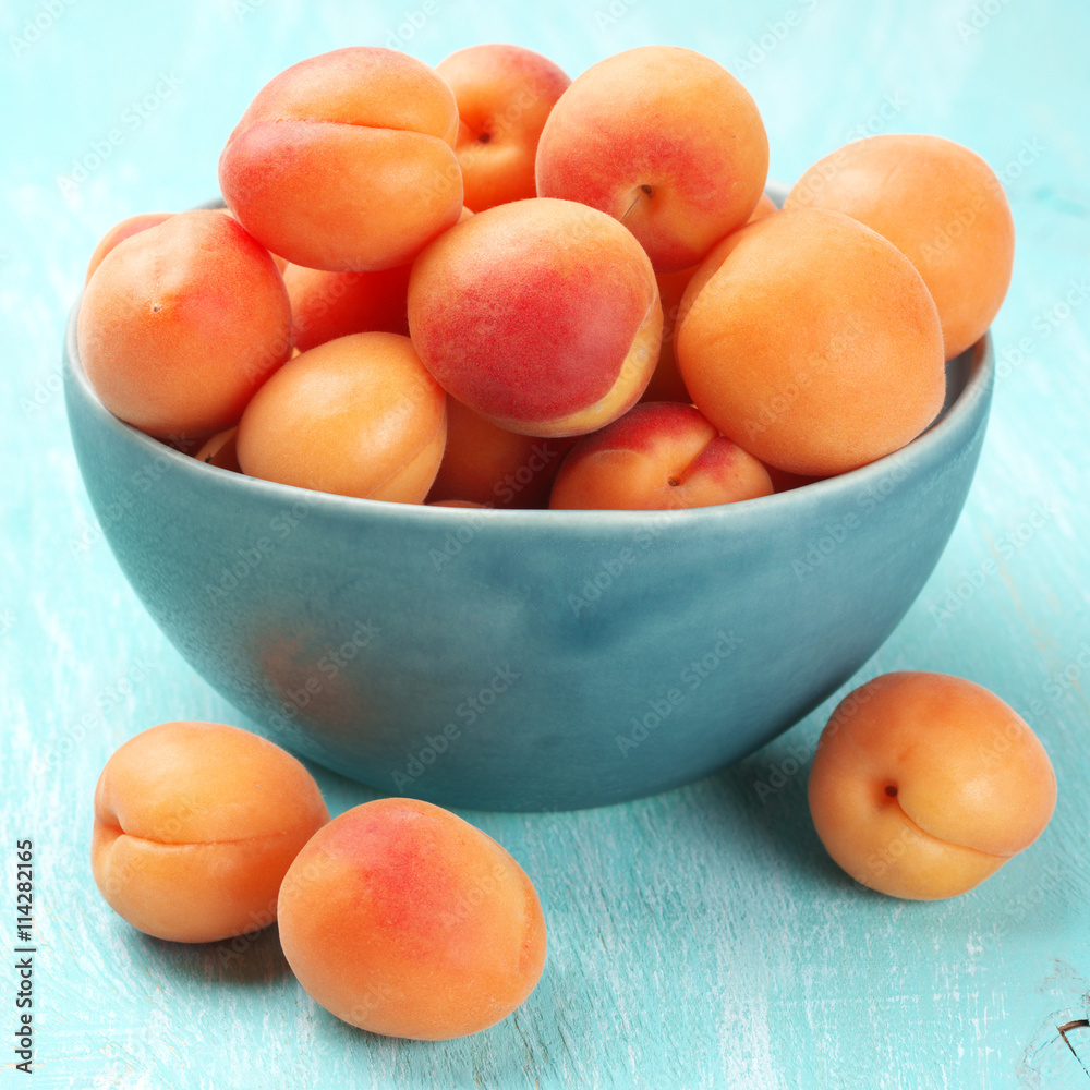 Apricots in blue bowl Apricots in blue bowl