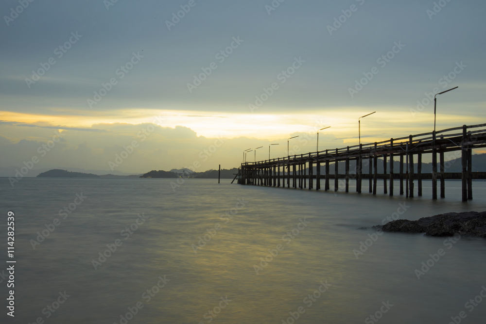 The wood bridge on sunset time in beautiful day, Ranong Thailand
