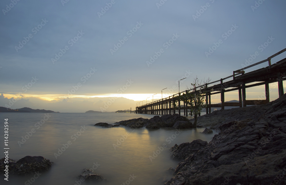 The wood bridge on sunset time in beautiful day, Ranong Thailand
