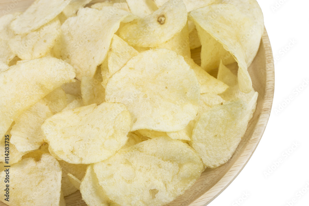 potato chips in wood plate on white background.
