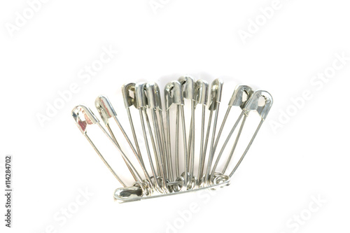 Safety Pins On The White Background, selective focus