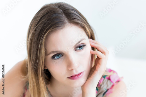 indoor portrait of a thinking woman
