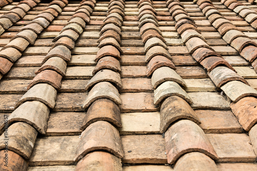 Old roof tiles on the roof of an old house