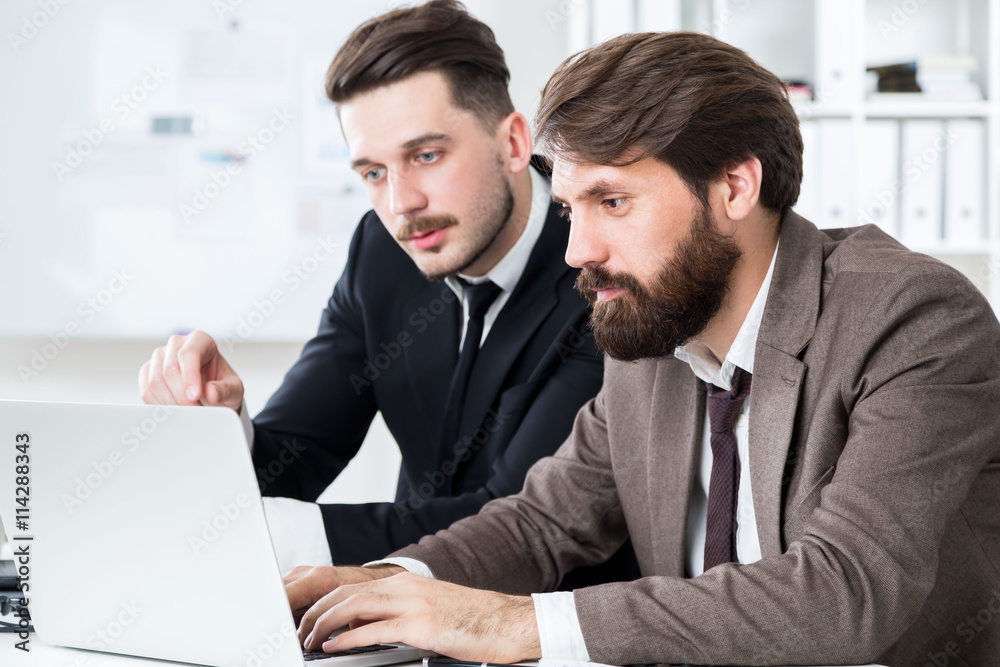 Stylish businesspeople discussing project Stylish businesspeople discussing project