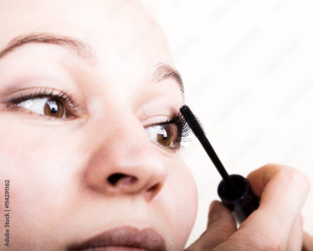 Beautiful young woman eyelash extension. Woman eye with long eyelashes. Beauty salon concept