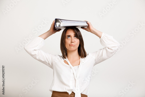 Portrait of young successful business woman over white backgroun